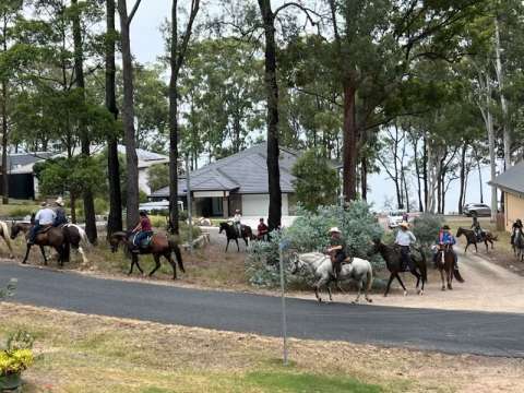 Horses and riders leaving Heros Reserve
